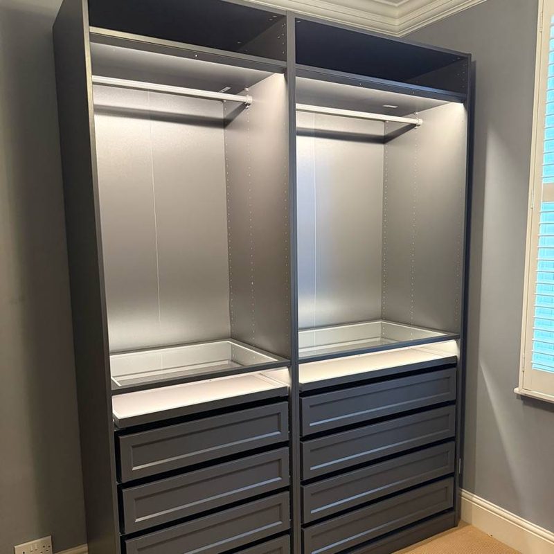 Dark grey IKEA PAX wardrobe with drawers and LED strip lighting in Salford